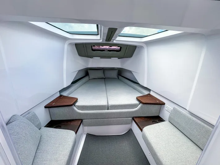 Yacht Photos Pics 2024 Axopar 37XC CROSS CABIN interior with modern seating and skylights.