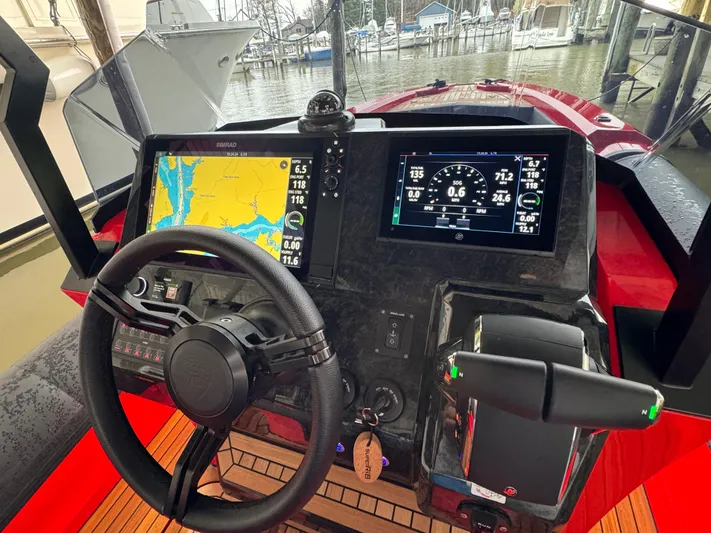  Yacht Photos Pics 2024 SuperRib Open 30 boat dashboard with navigation and control systems.