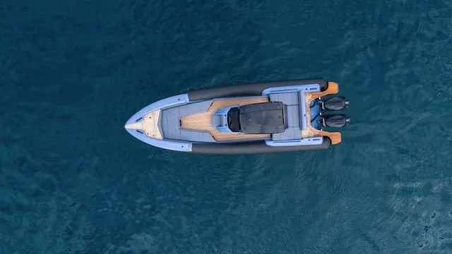  Yacht Photos Pics Aerial view of 2025 SuperRib Open 30 boat on blue water.