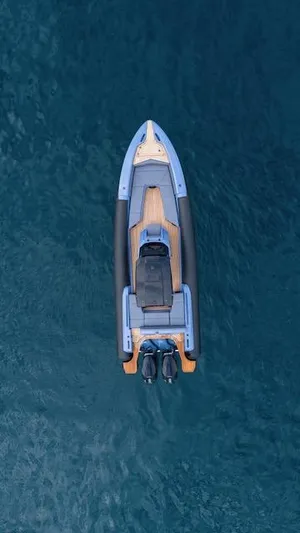  Yacht Photos Pics Aerial view of 2025 SuperRib Open 30 boat on calm blue water.