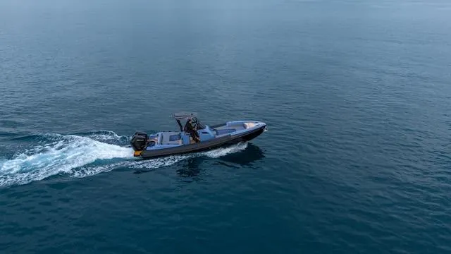  Yacht Photos Pics 2025 SuperRib Open 30 boat cruising on calm blue water.