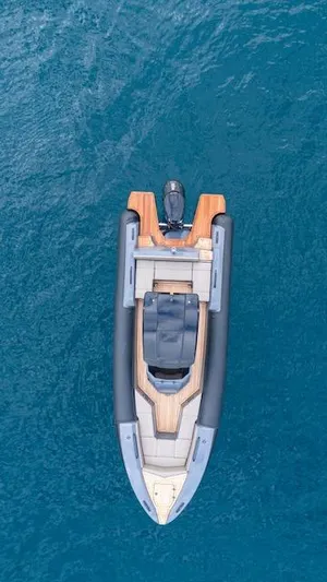  Yacht Photos Pics Aerial view of 2025 SuperRib Open 30 boat on blue water.