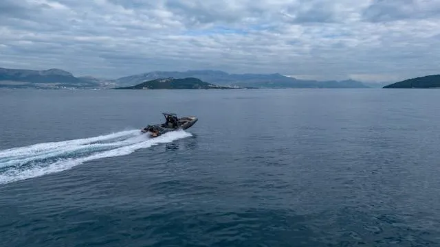  Yacht Photos Pics SuperRib Open 30 boat cruising on open water, 2025 model, under cloudy skies.