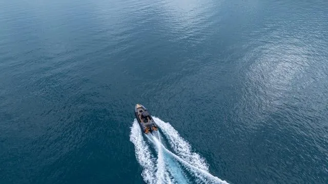  Yacht Photos Pics Aerial view of 2025 SuperRib Open 30 speedboat cruising on open water.