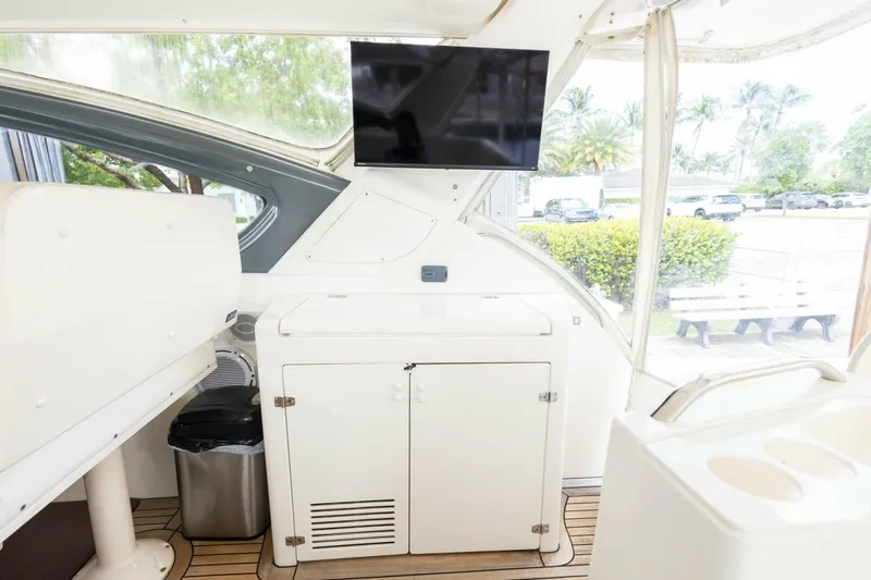  Yacht Photos Pics Interior of 2000 Tiara Yachts 5200 Express with TV and storage cabinet.