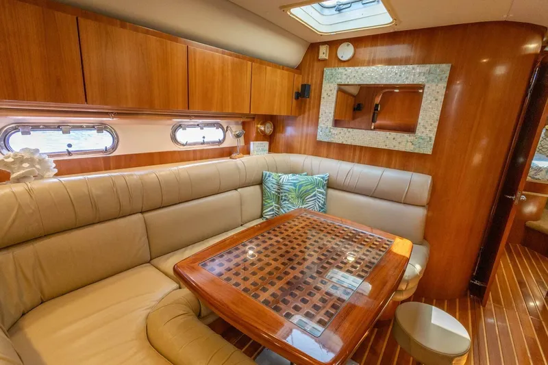  Yacht Photos Pics Luxurious interior of 2000 Tiara Yachts 5200 Express with elegant wood finish and plush seating.