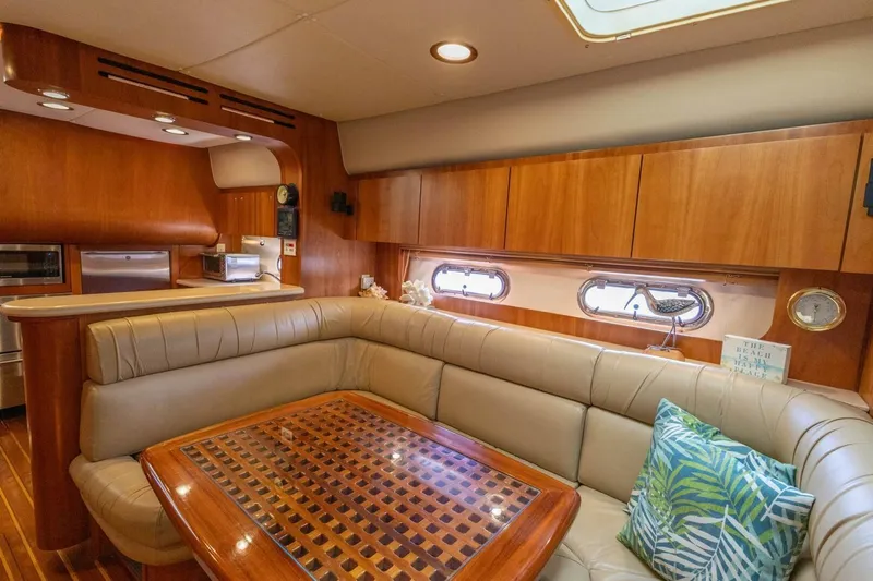  Yacht Photos Pics Luxurious interior of 2000 Tiara Yachts 5200 Express with elegant wood finishes and plush seating.