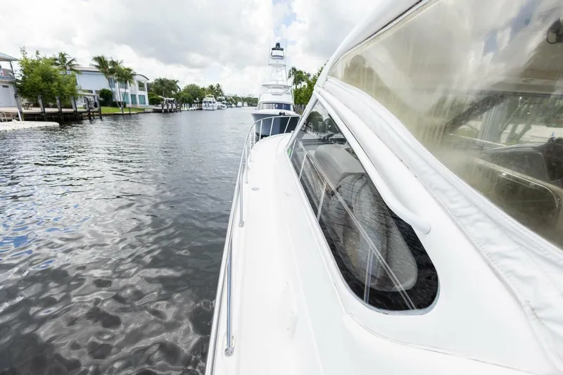  Yacht Photos Pics 2000 Tiara Yachts 5200 Express cruising on a scenic waterway.