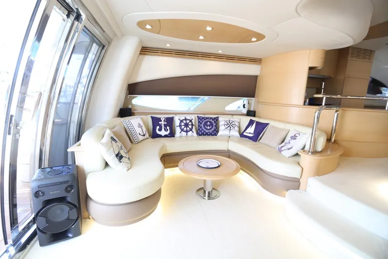 Azimut 62 Fly Yacht Photos Pics Luxurious interior of 2002 Azimut Fly 62 yacht with elegant seating and nautical decor.