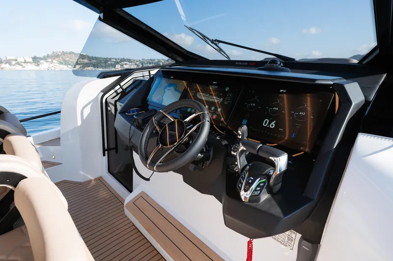  Yacht Photos Pics Modern helm of 2025 Salpa Soleil 52 yacht with advanced navigation displays.
