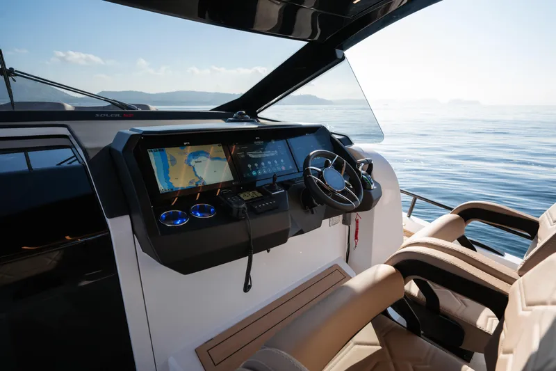  Yacht Photos Pics 2025 Salpa Soleil 52 yacht cockpit with modern navigation system and luxurious seating.