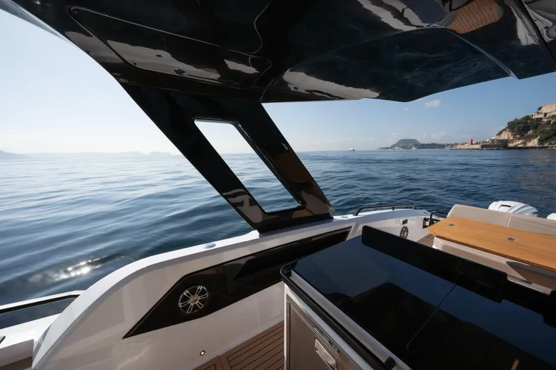  Yacht Photos Pics Luxurious 2025 Salpa Soleil 52 yacht with sleek design, cruising on calm waters.