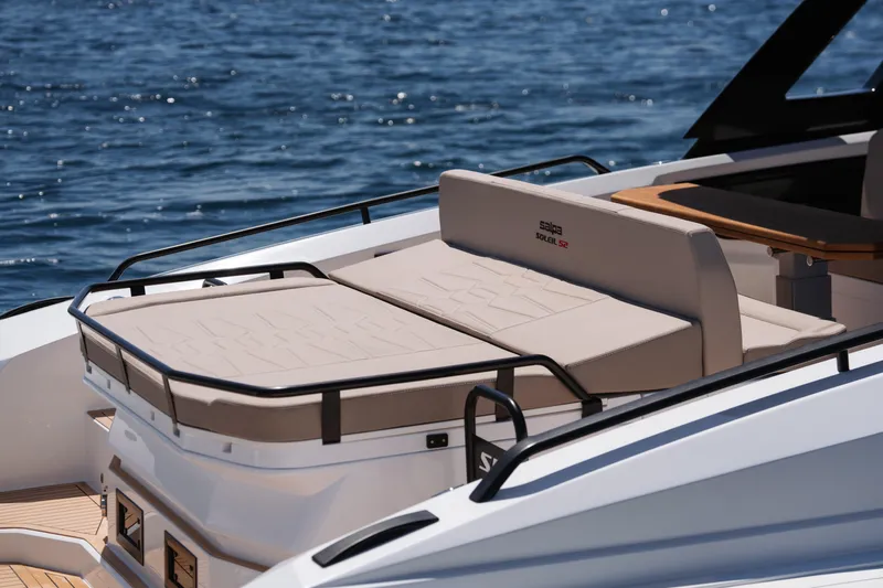  Yacht Photos Pics 2025 Salpa Soleil 52 luxury boat with sunbathing area on calm water.