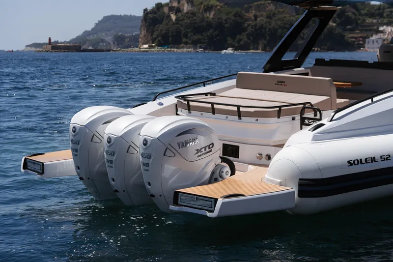  Yacht Photos Pics 2025 Salpa Soleil 52 boat with triple Yamaha engines on scenic water.