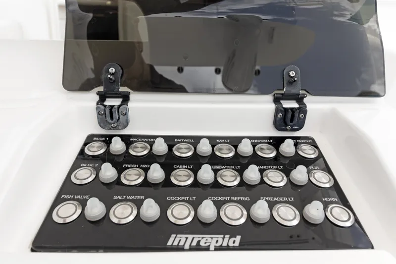  Yacht Photos Pics Control panel of a 2004 Intrepid 377 Walkaround boat with labeled switches.