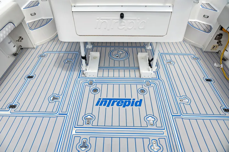  Yacht Photos Pics 2004 Intrepid 377 Walkaround boat deck with custom blue and white design.