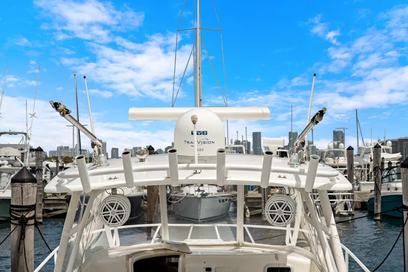  Yacht Photos Pics 2004 Intrepid 377 Walkaround yacht docked at marina under clear blue sky.