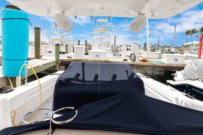  Yacht Photos Pics 2004 Intrepid 377 Walkaround boat docked at marina with clear blue sky.