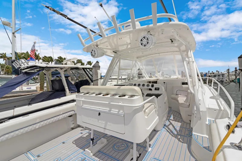  Yacht Photos Pics 2004 Intrepid 377 Walkaround boat with spacious deck and modern helm, docked at marina.