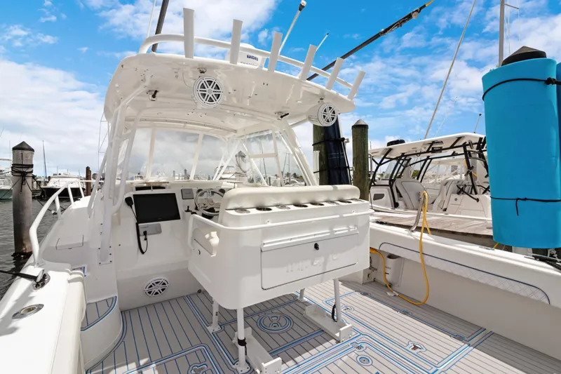  Yacht Photos Pics 2004 Intrepid 377 Walkaround boat docked, featuring spacious deck and modern amenities.