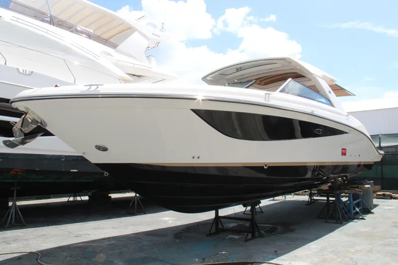  Yacht Photos Pics 2019 Sea Ray SLX 400 boat on stands, viewed from the side.