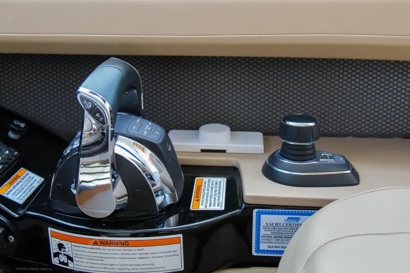  Yacht Photos Pics Control panel of a 2019 Sea Ray SLX 400 boat with throttle and joystick.