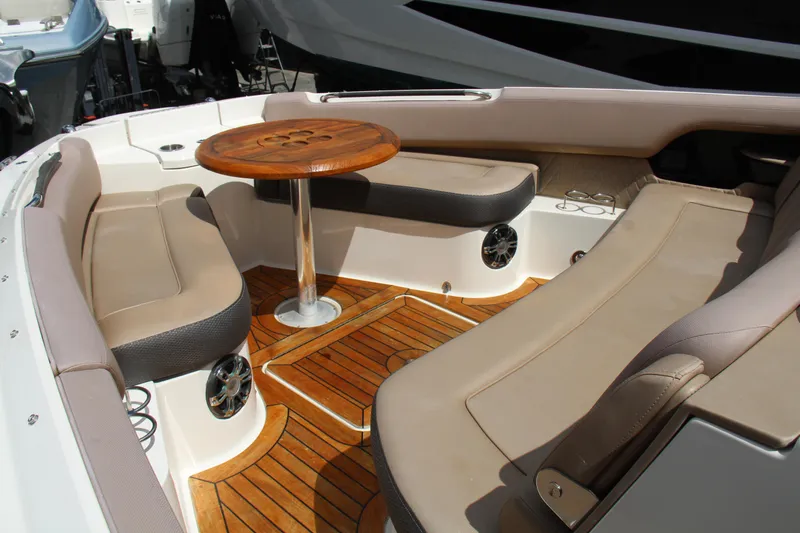  Yacht Photos Pics 2019 Sea Ray SLX 400 boat interior with teak flooring and cushioned seating.