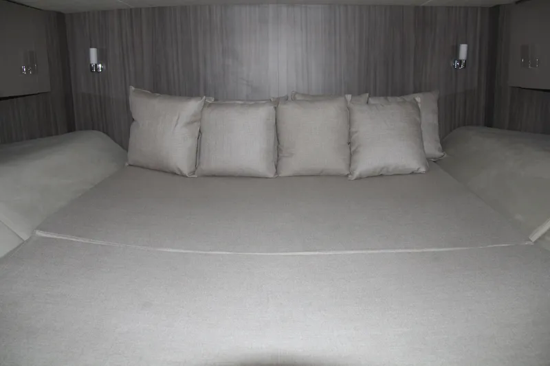  Yacht Photos Pics Luxurious cabin interior of 2019 Sea Ray SLX 400 with plush bedding and pillows.