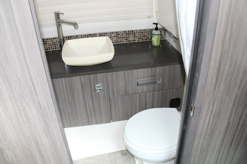  Yacht Photos Pics 2019 Sea Ray SLX 400 bathroom with modern sink and toilet.