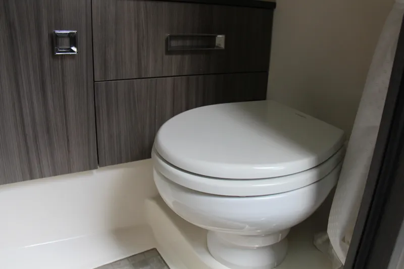  Yacht Photos Pics Modern bathroom in 2019 Sea Ray SLX 400 boat with sleek cabinetry and toilet.