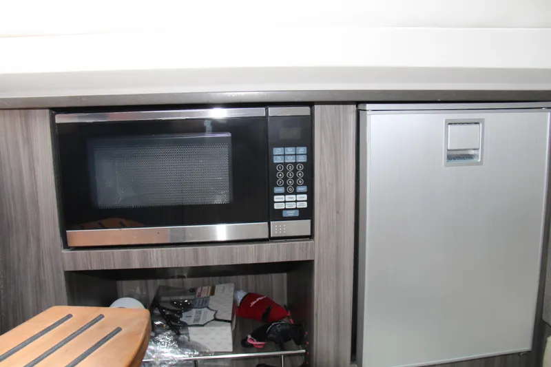  Yacht Photos Pics 2019 Sea Ray SLX 400 interior with microwave and mini fridge in modern kitchen area.