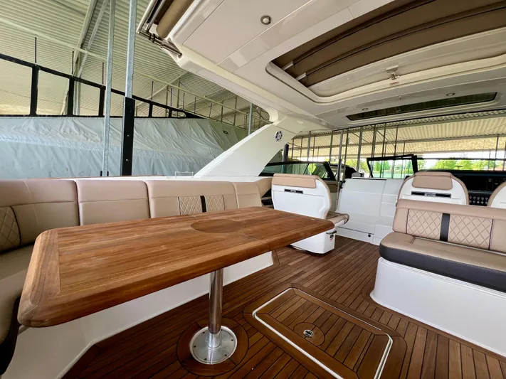  Yacht Photos Pics 2019 Sea Ray SLX 400 interior with elegant seating and wooden table.