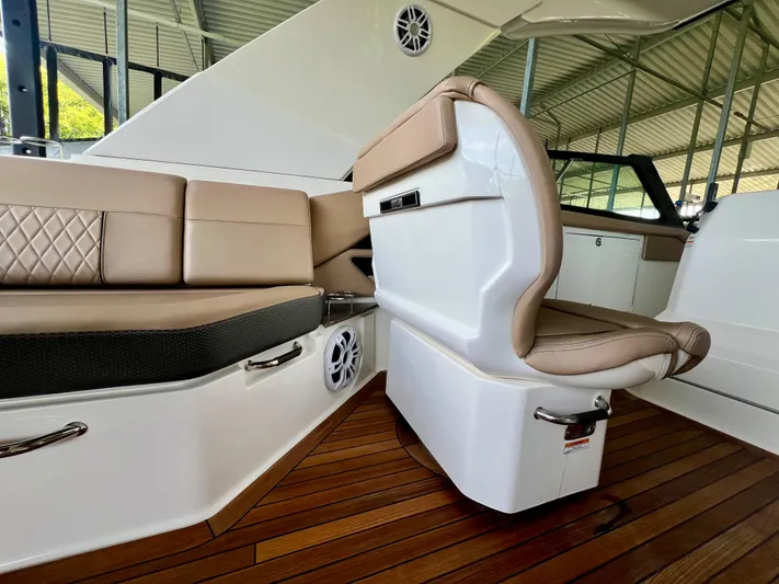  Yacht Photos Pics Luxurious interior of 2019 Sea Ray SLX 400 with tan leather seating and wood flooring.