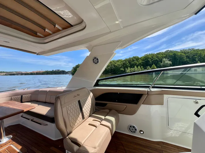  Yacht Photos Pics Luxurious 2019 Sea Ray SLX 400 boat interior with plush seating and scenic water view.