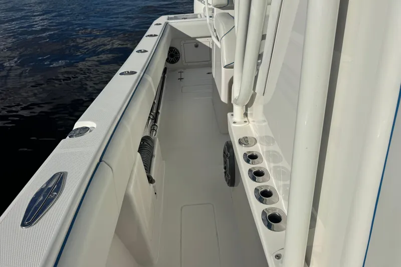  Yacht Photos Pics 2024 SeaVee 290B boat deck with rod holders and sleek design.