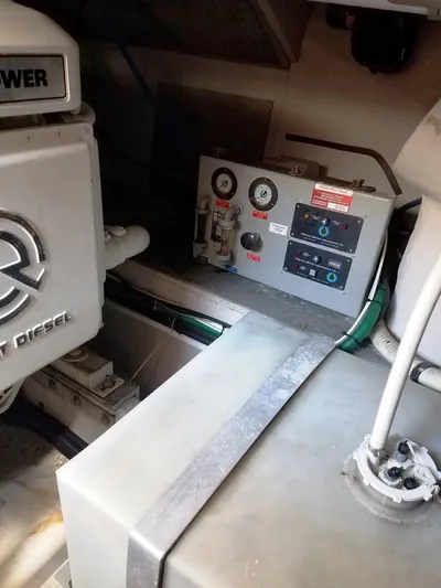 Golden Eagle Yacht Photos Pics Engine room of 1996 Sea Ray 500 Sundancer with control panel and machinery.