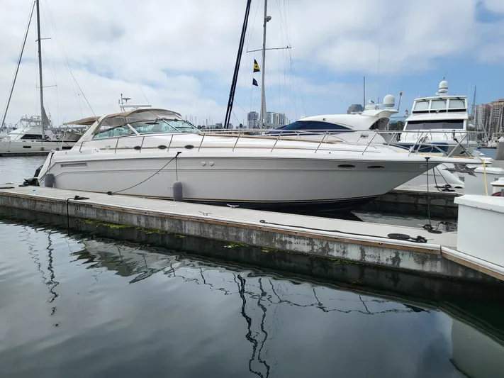 Golden Eagle Yacht Photos Pics 1996 Sea Ray 500 Sundancer yacht docked in a marina, surrounded by other boats.