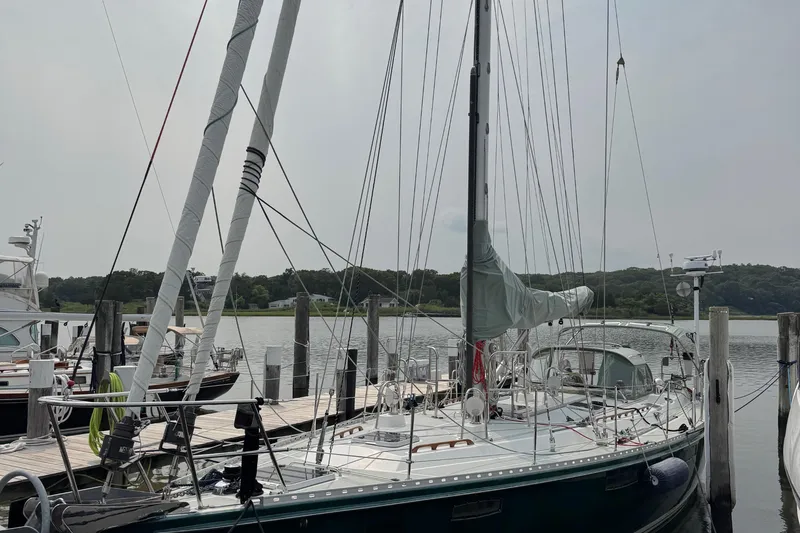 Mara Yacht Photos Pics Sailboat docked at marina, Able Apogee 50, 1998 model, calm waters, overcast sky.