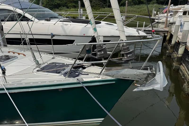 Mara Yacht Photos Pics Sailboat docked with anchor, Able Apogee 50, 1998 model, in a marina setting.