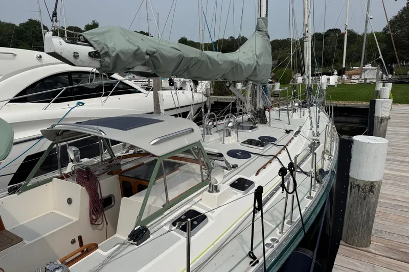 Mara Yacht Photos Pics Sailboat docked at marina, Able Apogee 50, 1998 model, with covered sails.