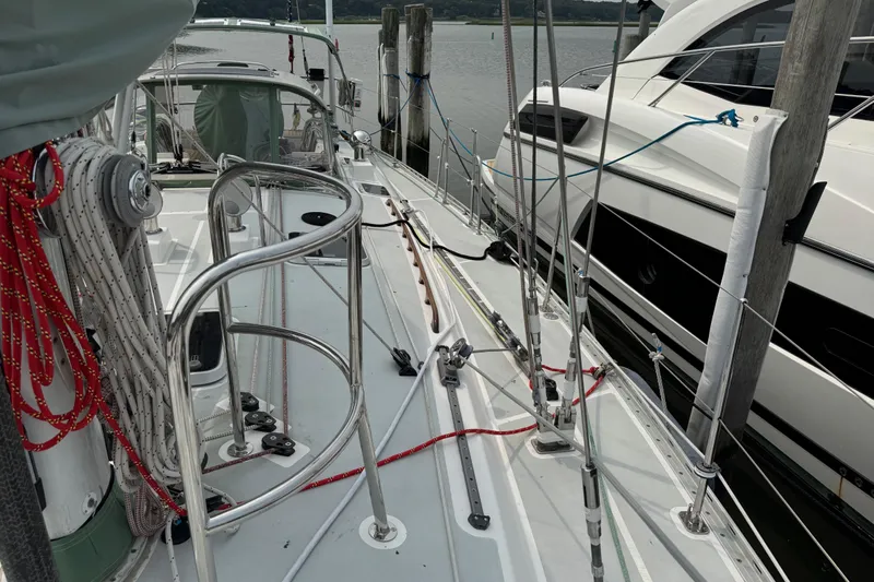 Mara Yacht Photos Pics Sailboat deck view, Able Apogee 50, 1998 model, docked beside another boat.