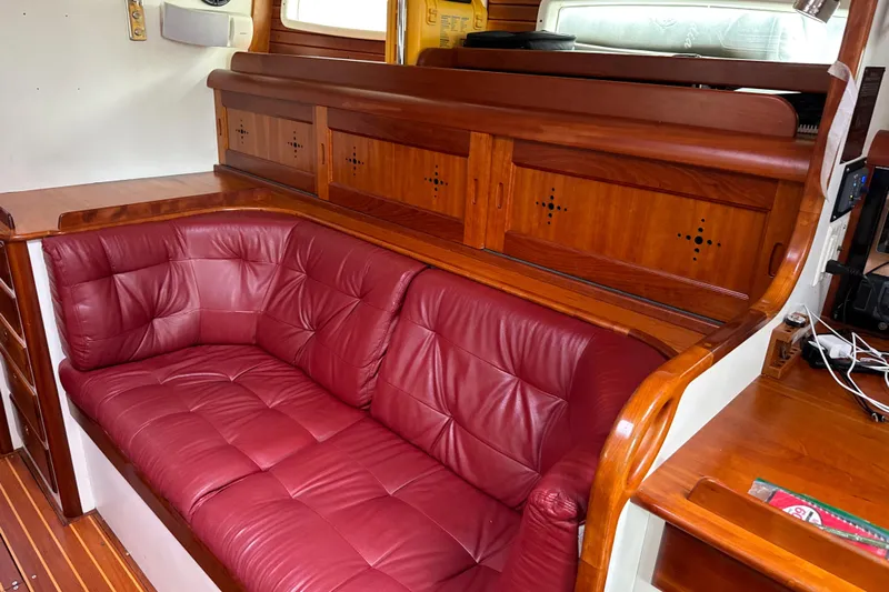 Mara Yacht Photos Pics Luxurious red leather seating in 1998 Able Apogee 50 yacht interior.