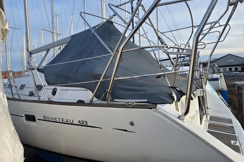  Yacht Photos Pics Beneteau Oceanis Clipper 423 sailboat, 2003 model, docked with protective cover.