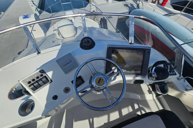 Tuva- B - Lu Yacht Photos Pics 2015 Cutwater 30 Command Bridge helm with Garmin navigation system and steering wheel.