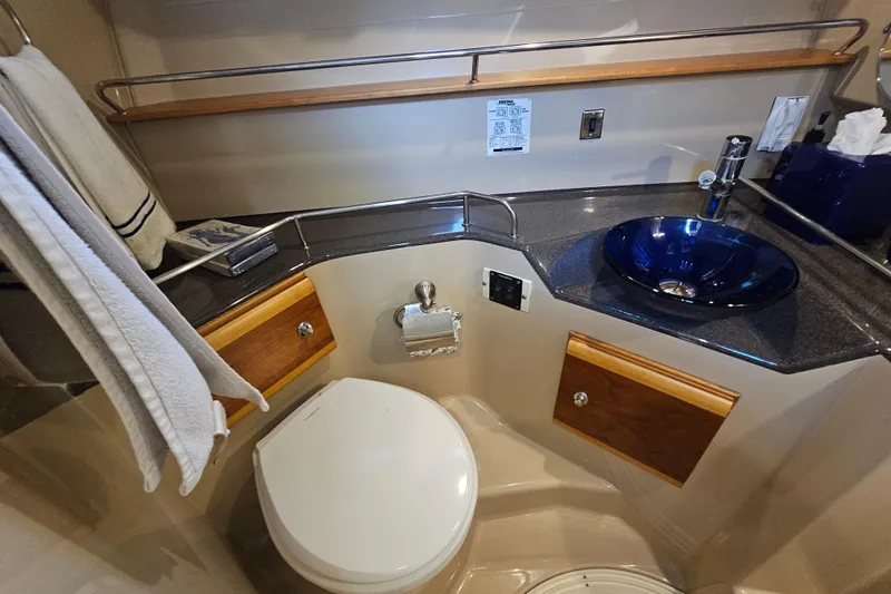 Tuva- B - Lu Yacht Photos Pics 2015 Cutwater 30 Command Bridge bathroom with modern sink and toilet.