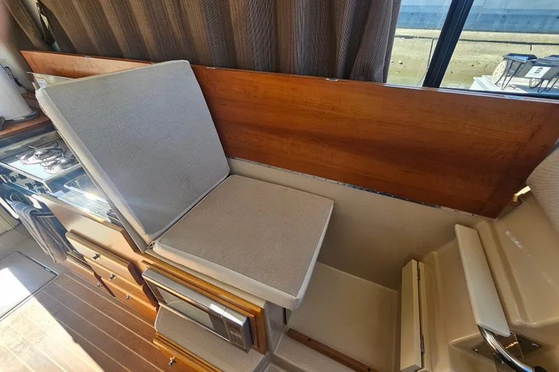 Tuva- B - Lu Yacht Photos Pics Interior of 2015 Cutwater 30 Command Bridge with seating and kitchen area.