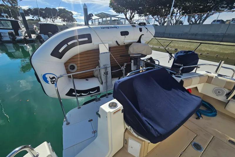 Tuva- B - Lu Yacht Photos Pics 2015 Cutwater 30 Command Bridge with inflatable boat at marina dock.