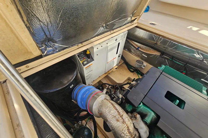Tuva- B - Lu Yacht Photos Pics Engine compartment of a 2015 Cutwater 30 Command Bridge boat, showing mechanical components.
