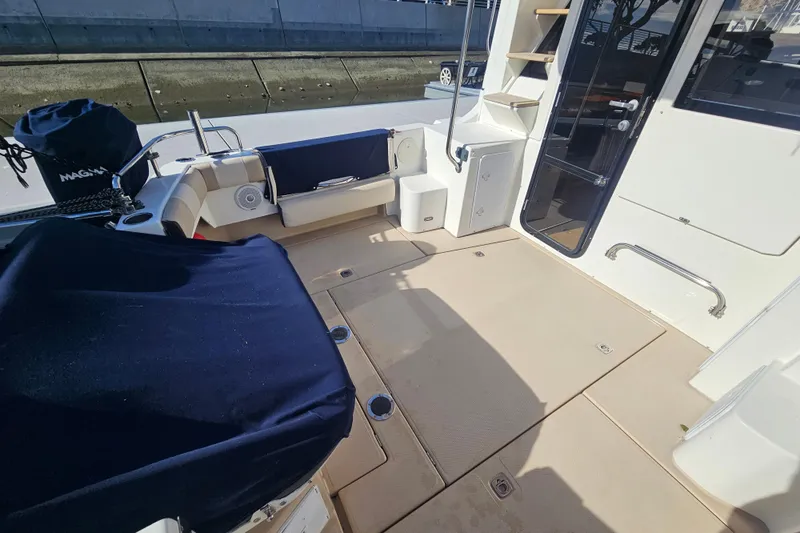 Tuva- B - Lu Yacht Photos Pics 2015 Cutwater 30 Command Bridge boat deck with seating and storage.