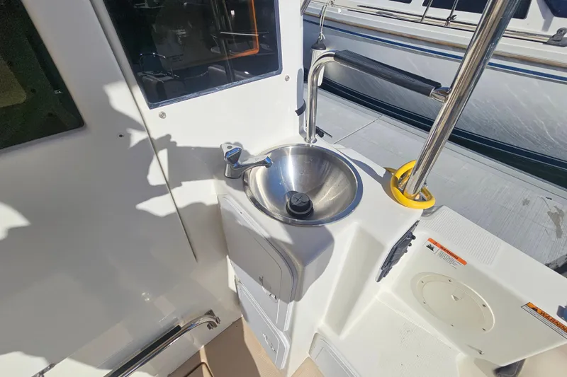 Tuva- B - Lu Yacht Photos Pics 2015 Cutwater 30 Command Bridge boat sink and deck area.